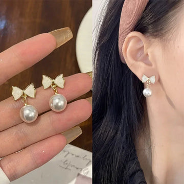 DAIIIBABYYY  -  Temperament Trendy White Bowknot Pearl Drop Dangle Earrings for Women Classic Butterfly Stud Earrings Party Jewelry Accessories